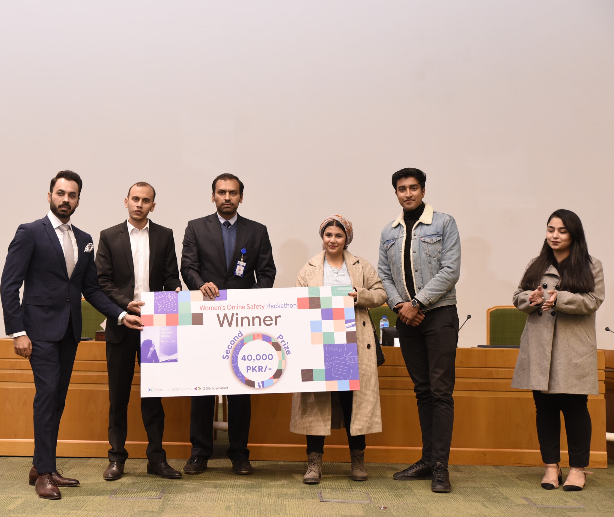Second prize team accepting the PKR 40,000 cheque on stage