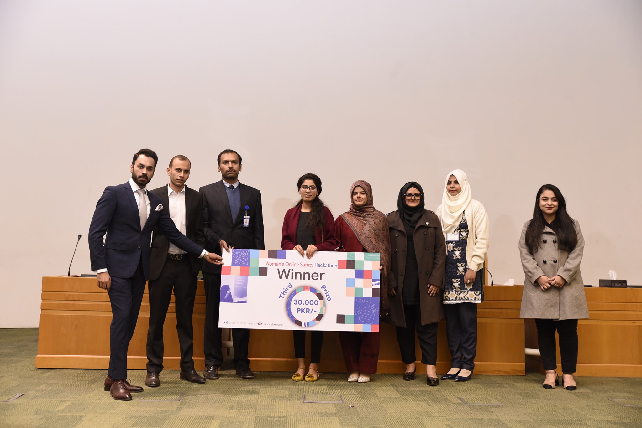 Third prize team with the PKR 30,000 cheque on stage